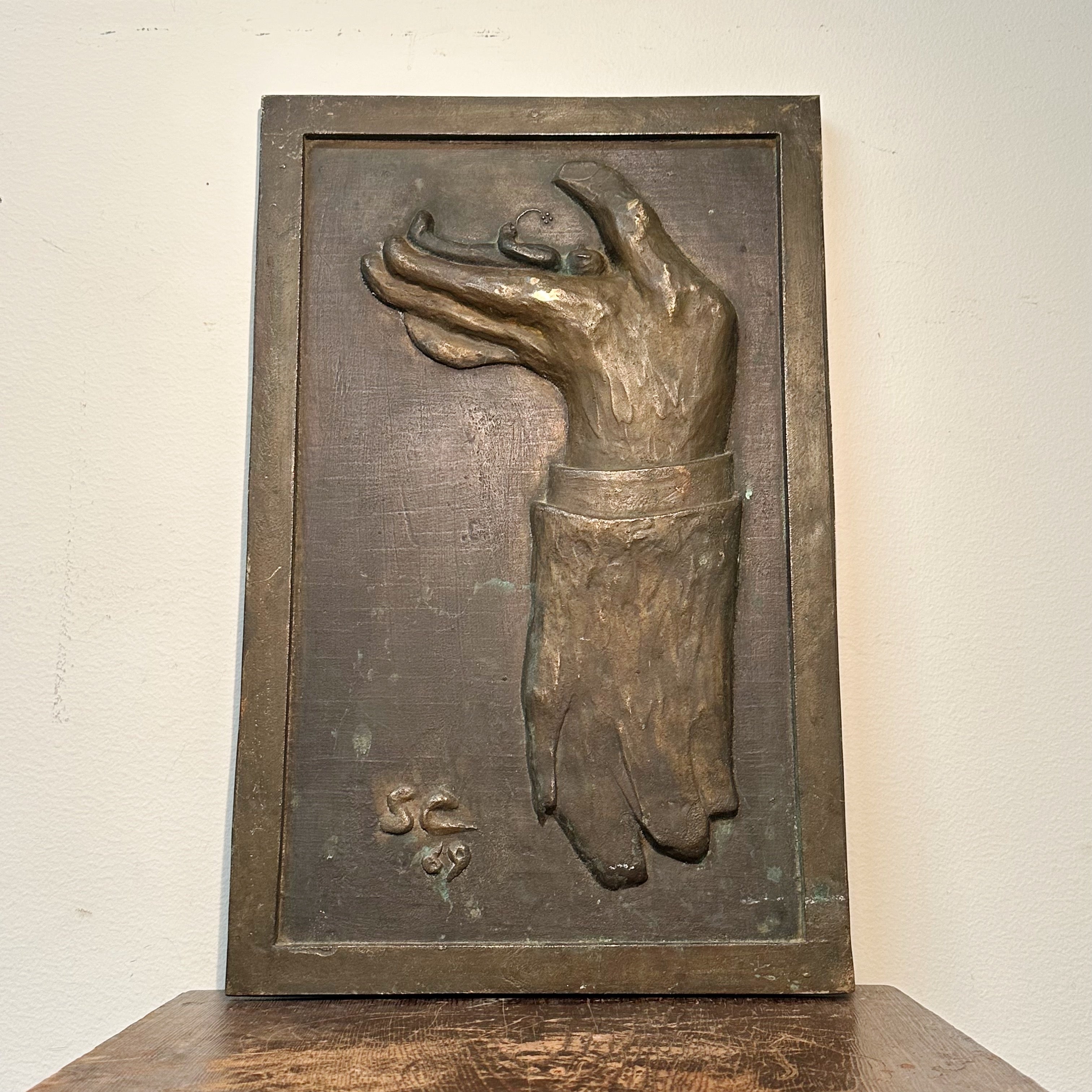 1960s Surreal Bronze Relief of Hand Raising a Body at Rest with Flower
