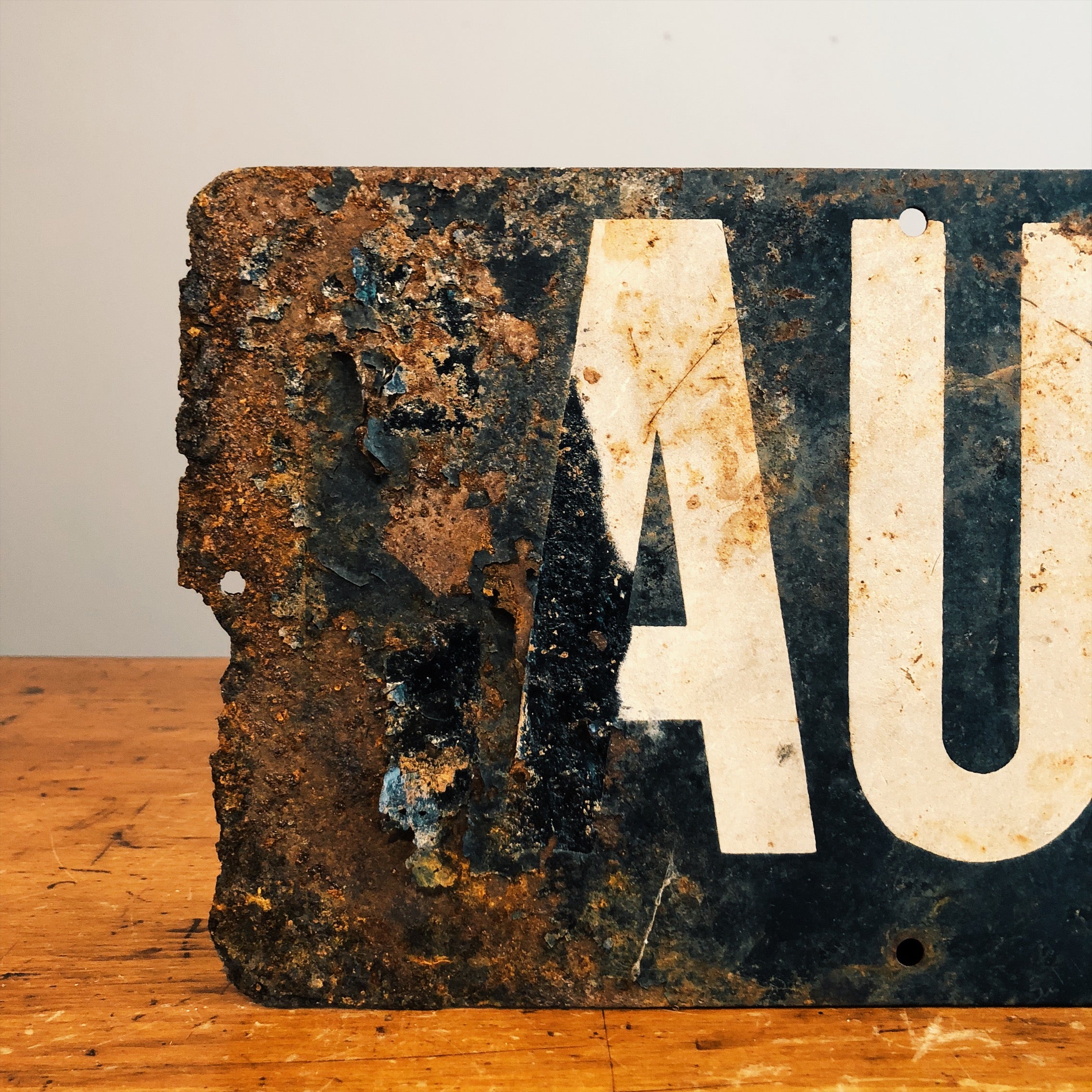 Front view of corrosion on Vintage Railroad Sign